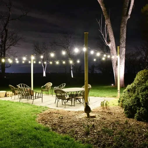 Warm white outdoor solar lighting around a hospitality patio
