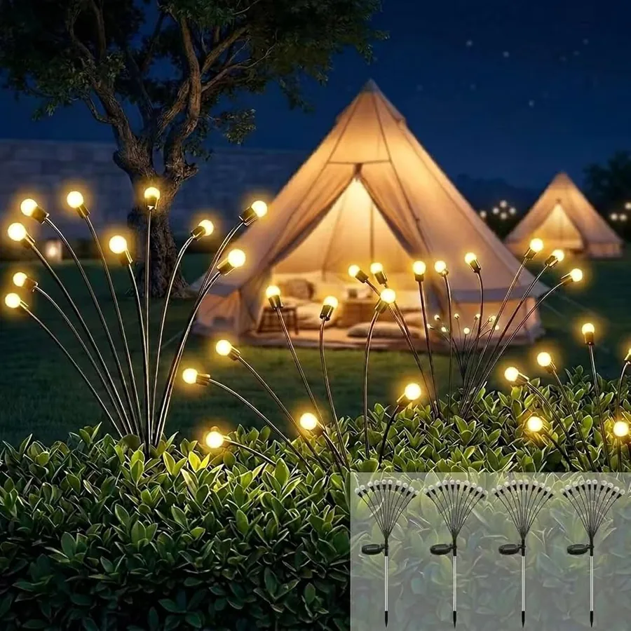 Firefly sway solar lights glowing above garden plants near a glamping tent at night