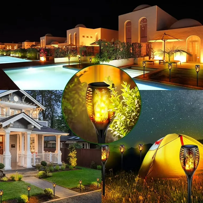 Solar torch lights with realistic flickering flame effect lighting a resort walkway at night